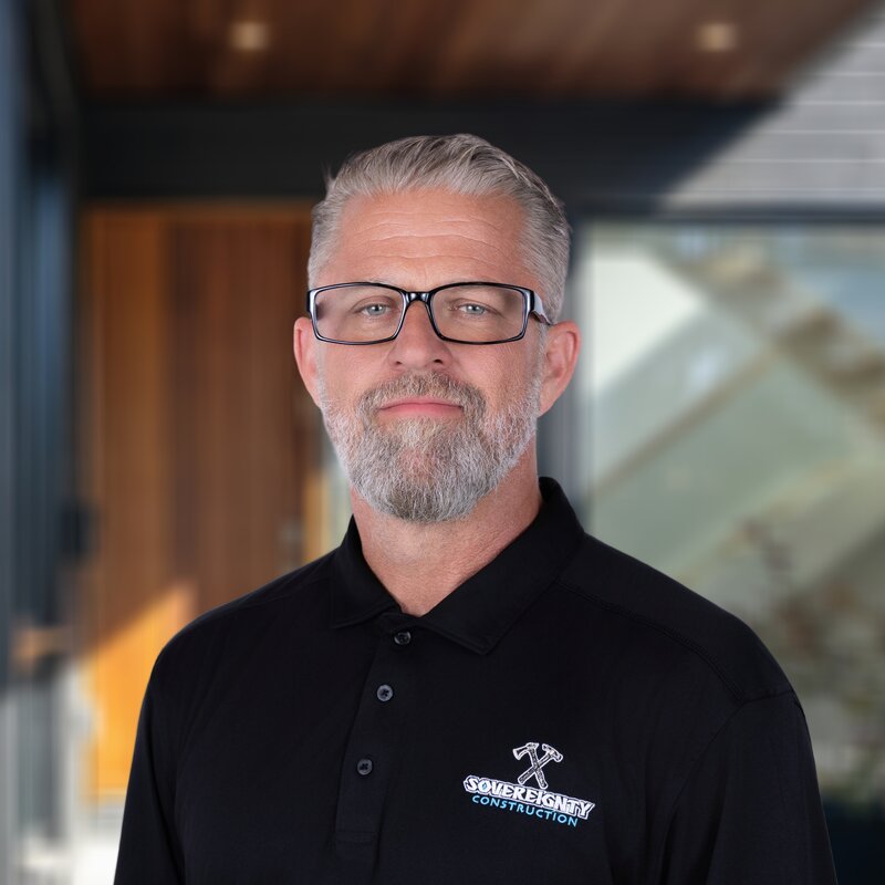 Headshot of Matthew Bergman, Construction Superintendent at Sovereignty Construction, wearing a branded polo.