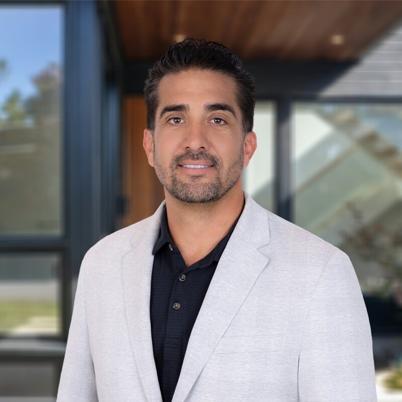 Headshot of Steven M. Leash Jr., President & CEO of Sovereignty Construction, in a light blazer.